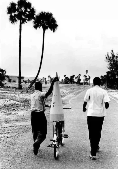 Historical image of ISRO scientists transporting satellite equipment on a bullock cart.